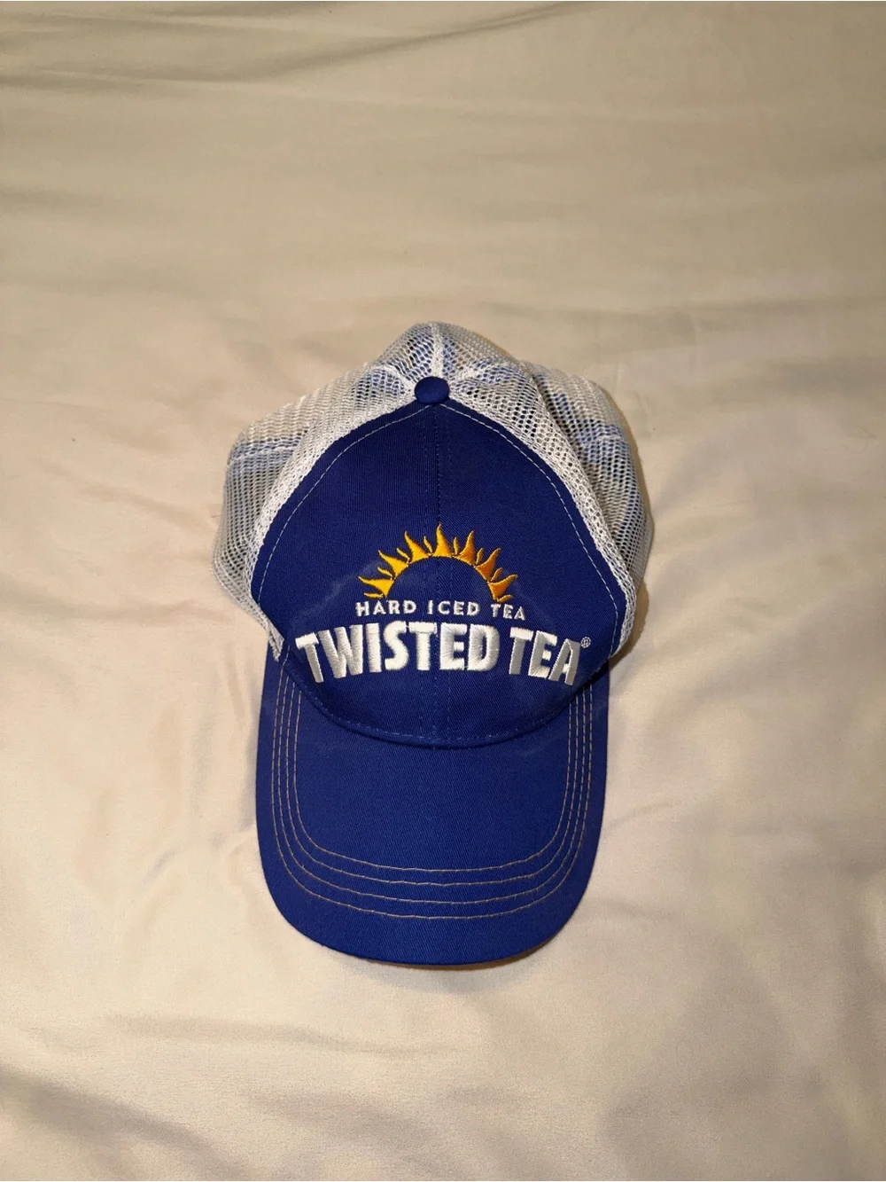 Twisted Tea Royal Blue and White Mesh Trucker Hat with Sun Logo